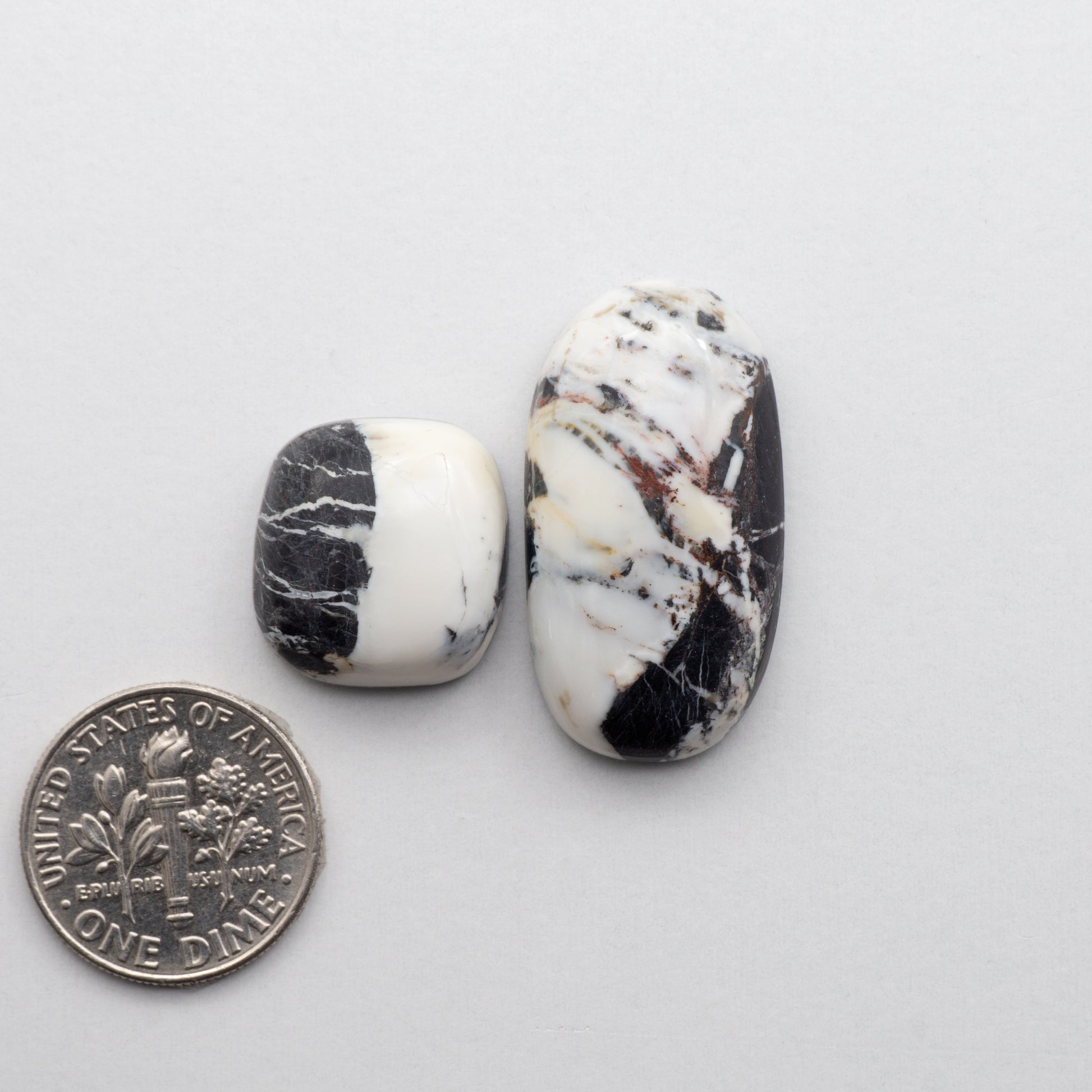 These Natural White Buffalo Stone Cabochons are semi-precious gemstones cut into shapes ideal for jewelry-making