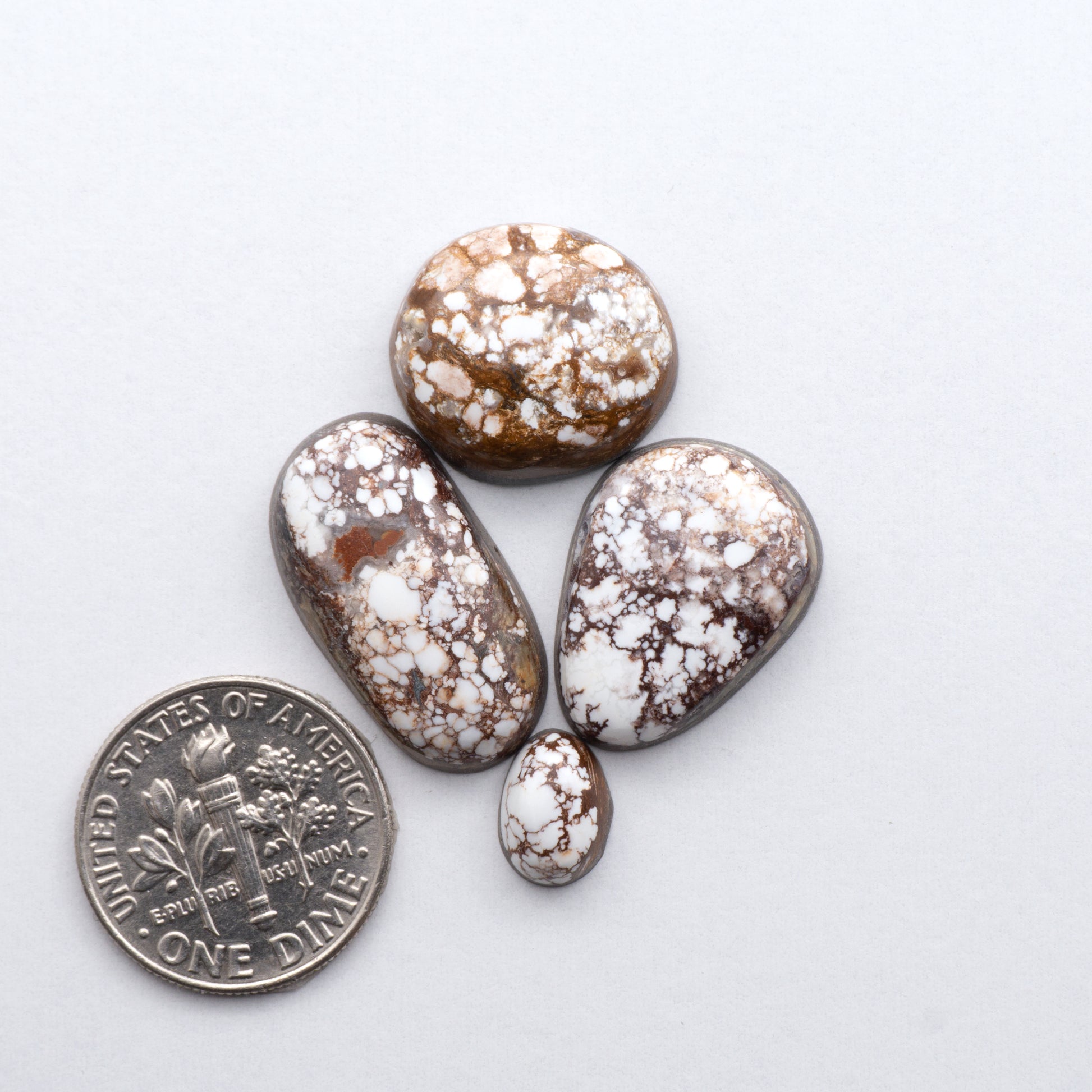 This stunning Wild Horse Cabochon lot is a magnificent addition to any collection. These natural magnesite stones features an intricate design that will instantly add beauty and sophistication to any jewelry design.