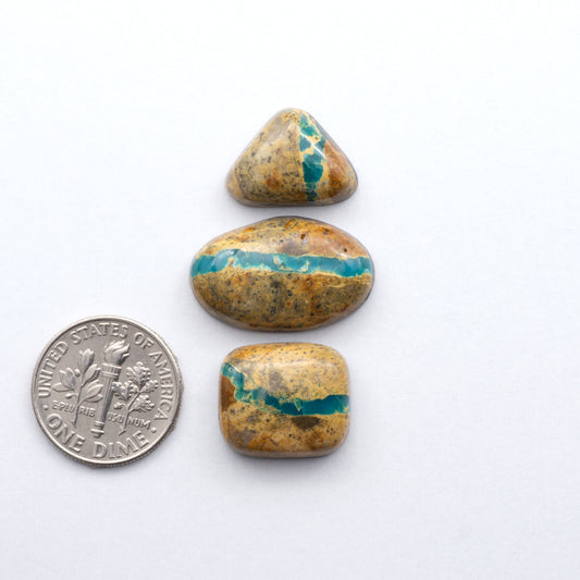 Royston Ribbon Turquoise cabochons are renowned for their unique shades of green, blues, making these cabochons a popular choice for jewelry makers.