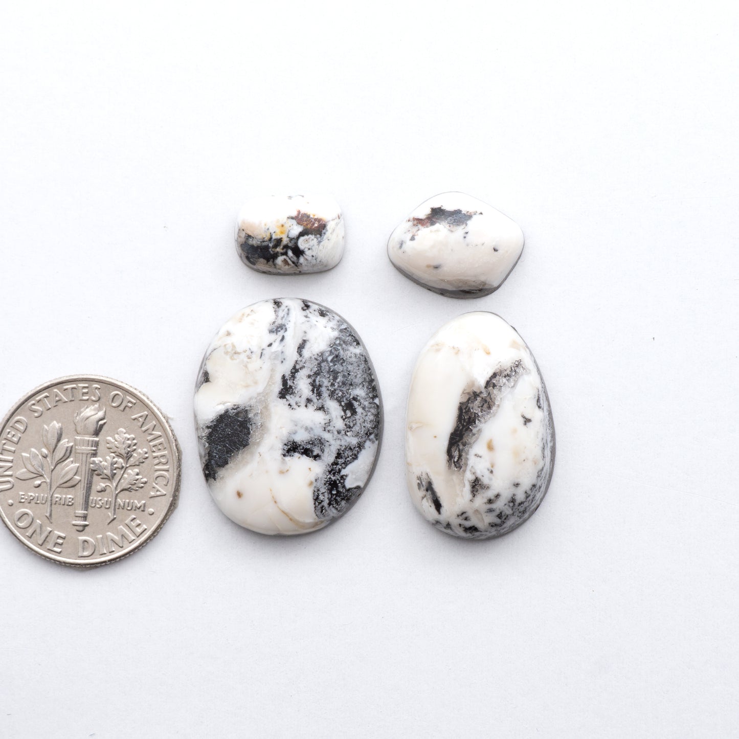 These Natural White Buffalo Stone Cabochons are semi-precious gemstones cut into shapes ideal for jewelry-making and crafting and are backed for added strength.