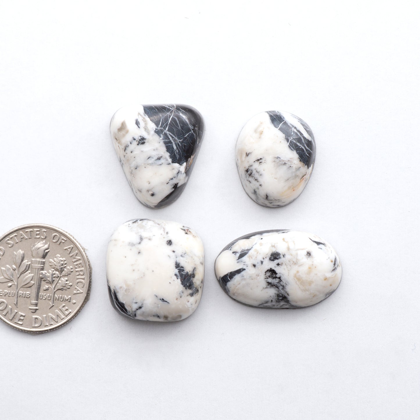 These Natural White Buffalo Stone Cabochons are semi-precious gemstones cut into shapes ideal for jewelry-making and crafting and are backed for added strength.