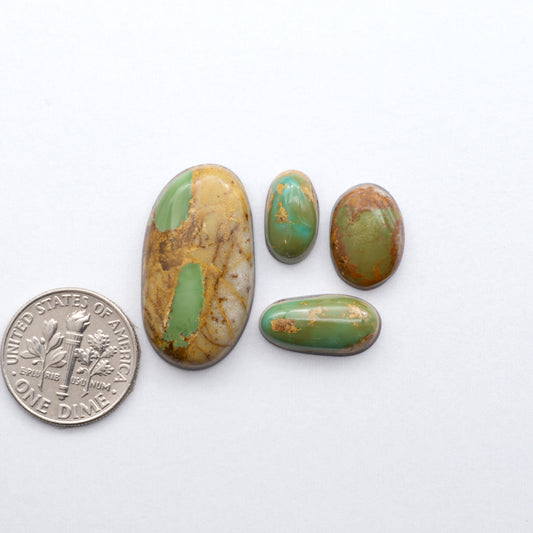 Royston Ribbon Turquoise cabochons are renowned for their unique shades of green, blues, making these cabochons a popular choice for jewelry makers.