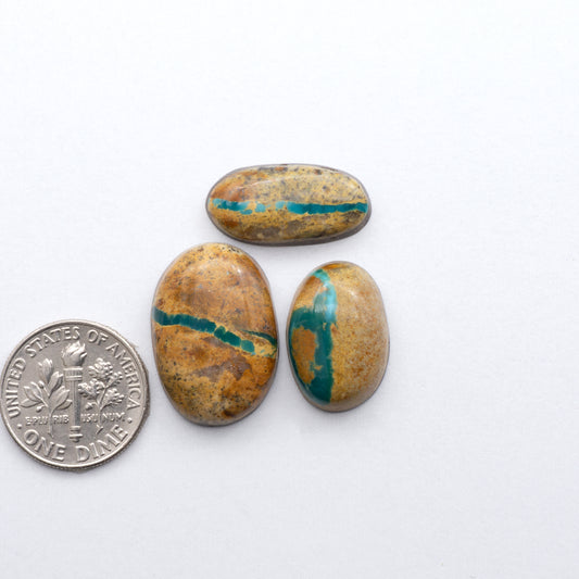 Royston Ribbon Turquoise cabochons are renowned for their unique shades of green, blues, making these cabochons a popular choice for jewelry makers.