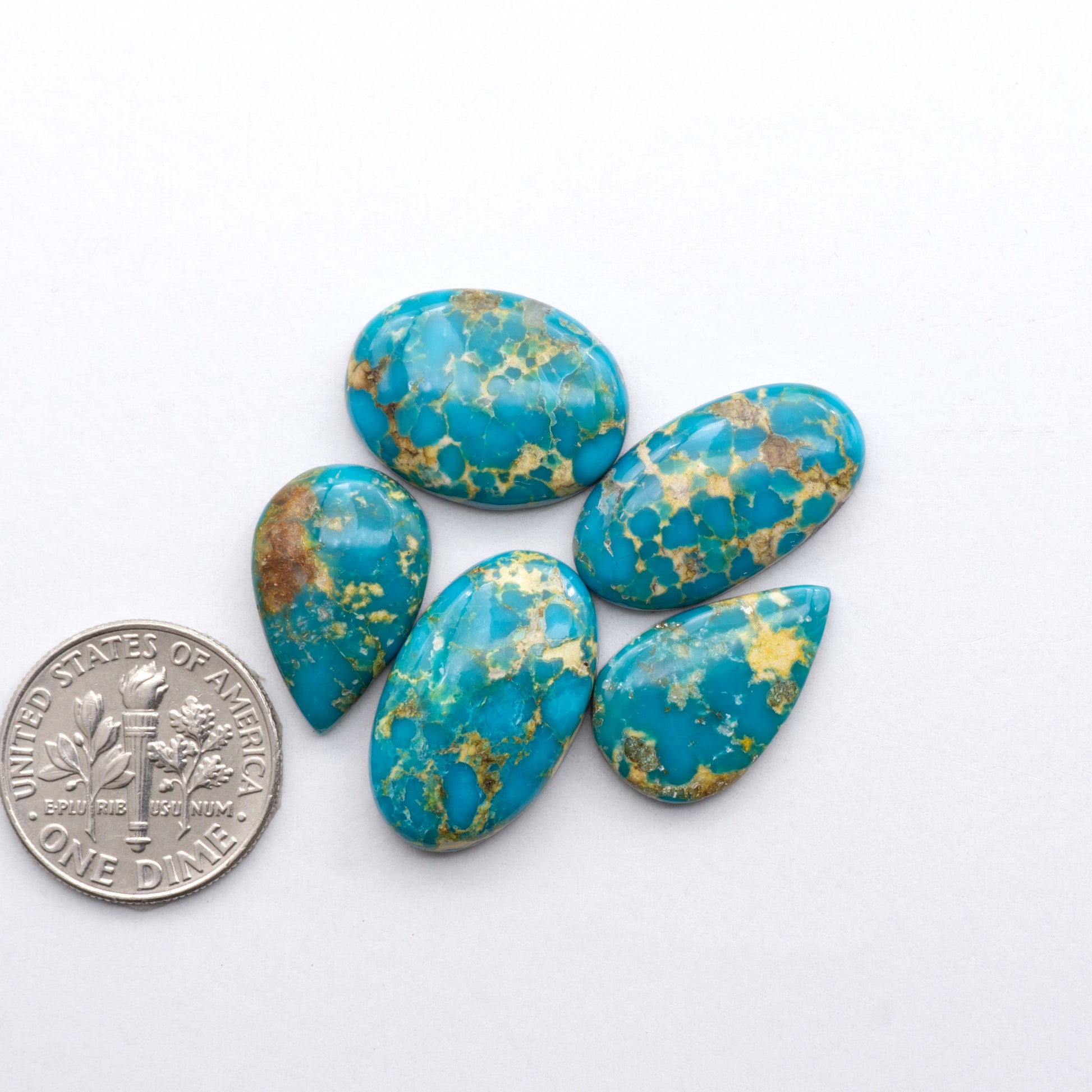 Gorgeous Sonoran South Hill Turquoise cabochons perfect for jewelry making or collecting. Known for its stunning blue-green color and rarity, this gem will add a touch of elegance to any piece.