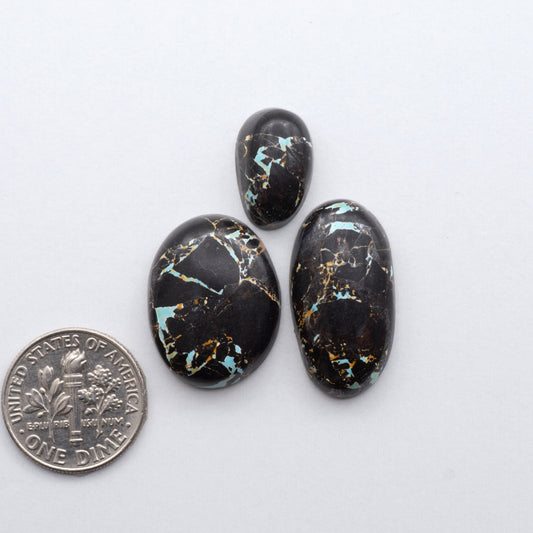 Discover the unique beauty of Natural Black Jack Turquoise. This rare gemstone features a bold black color with striking veins of turquoise, making it a truly one-of-a-kind addition to your jewelry collection.