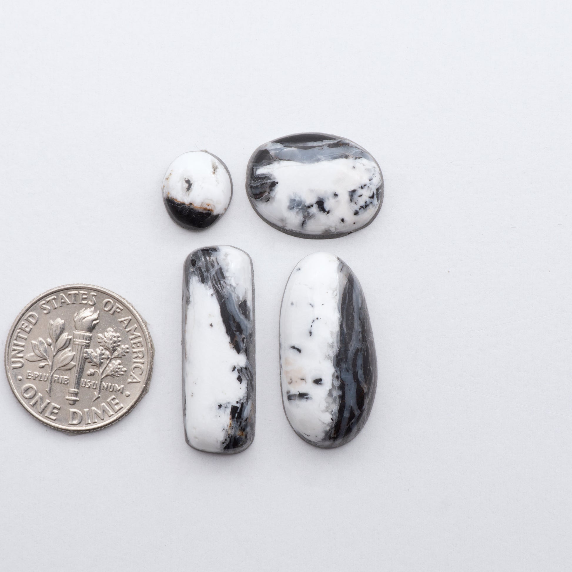 These Natural White Buffalo Stone Cabochons are semi-precious gemstones cut into shapes ideal for jewelry-making and crafting and are backed for added strength. 