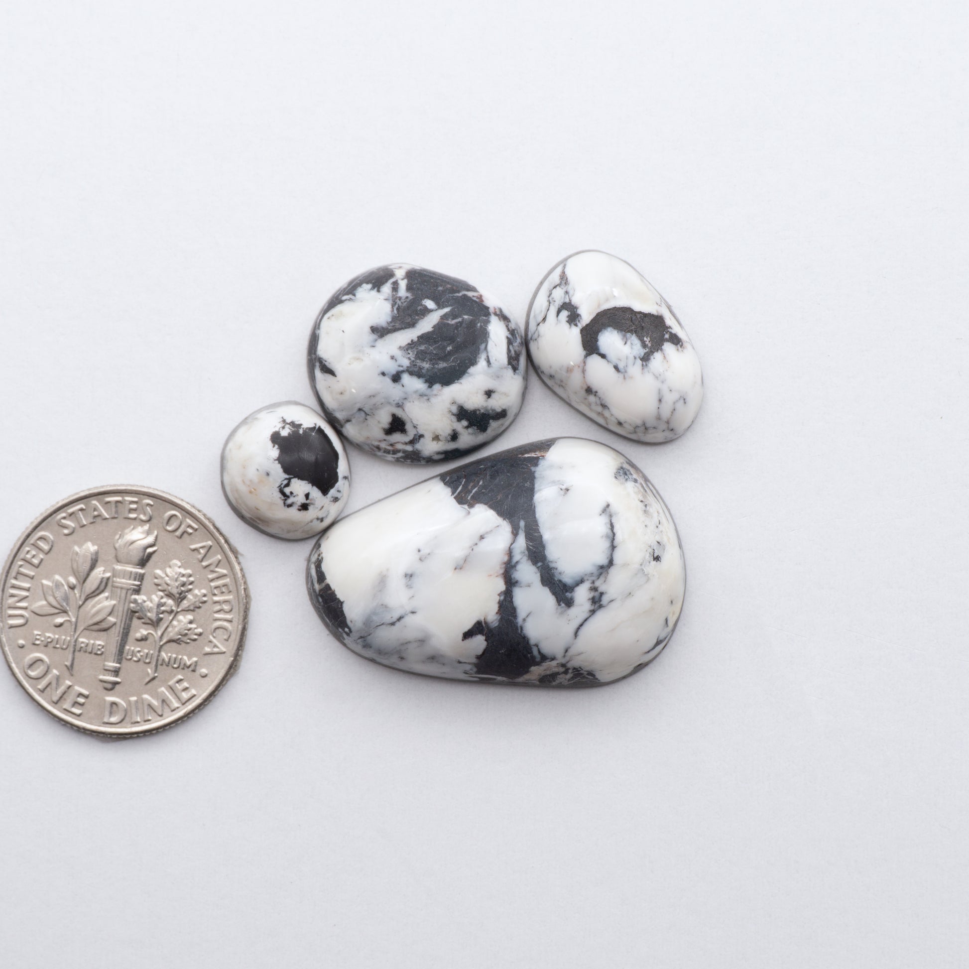 These Natural White Buffalo Stone Cabochons are semi-precious gemstones cut into shapes ideal for jewelry-making and crafting and are backed for added strength. 