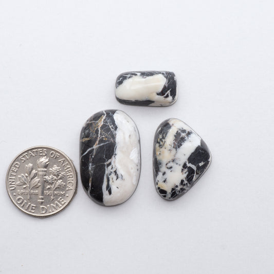 These Natural White Buffalo Stone Cabochons are semi-precious gemstones cut into shapes ideal for jewelry-making 