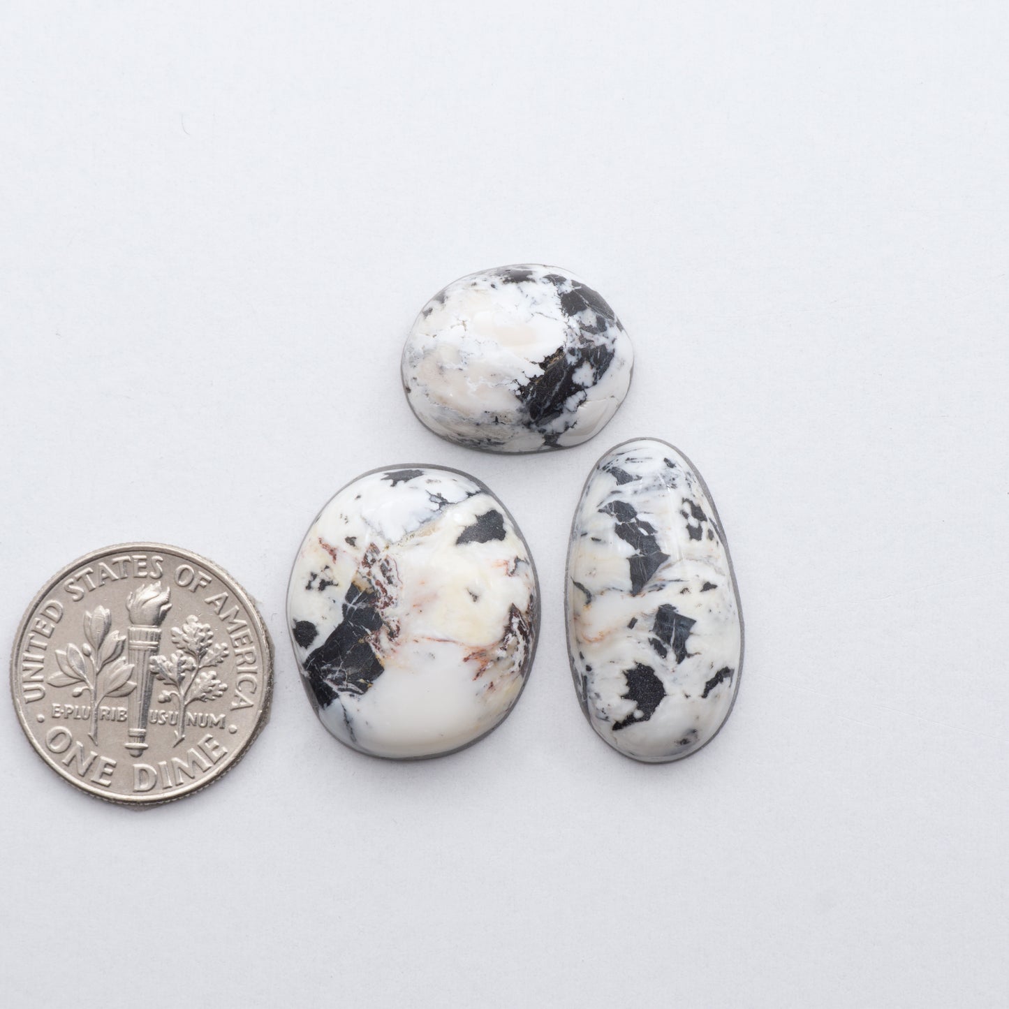 These Natural White Buffalo Stone Cabochons are semi-precious gemstones cut into shapes ideal for jewelry-making and crafting and are backed for added strength. 