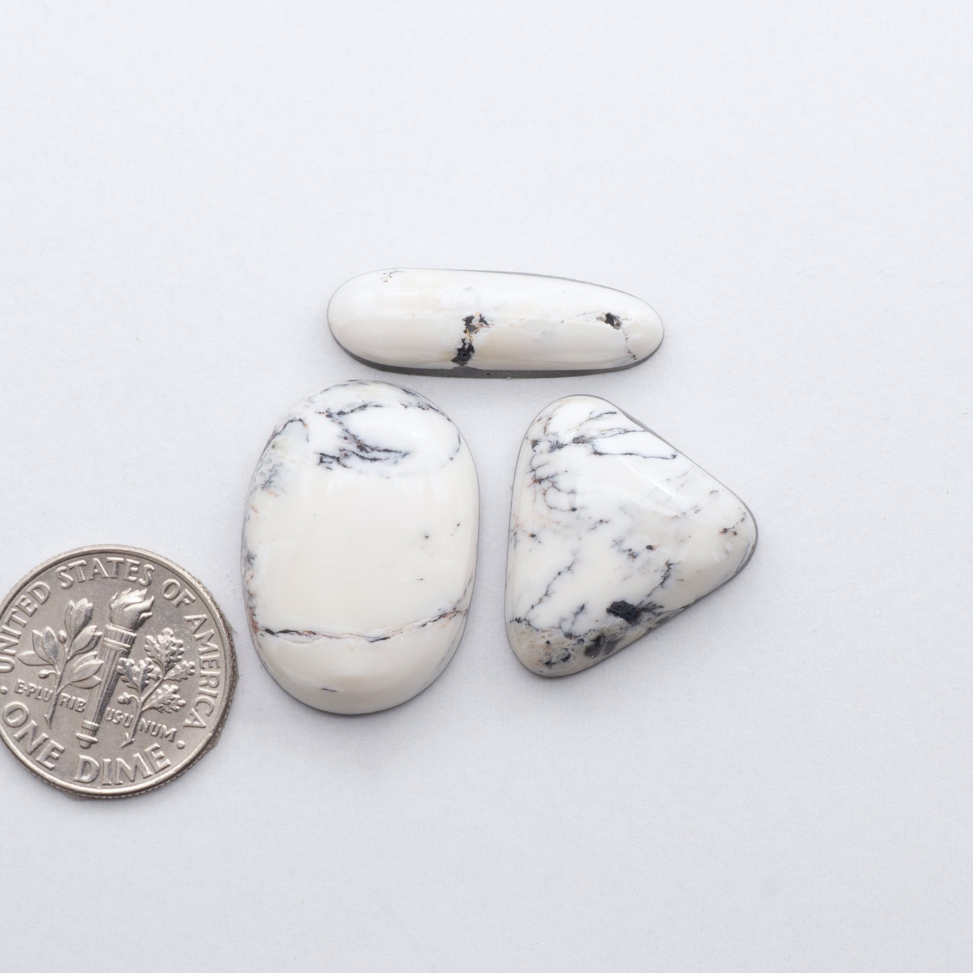 These Natural White Buffalo Stone Cabochons are semi-precious gemstones cut into shapes ideal for jewelry-making and crafting and are backed for added strength. 