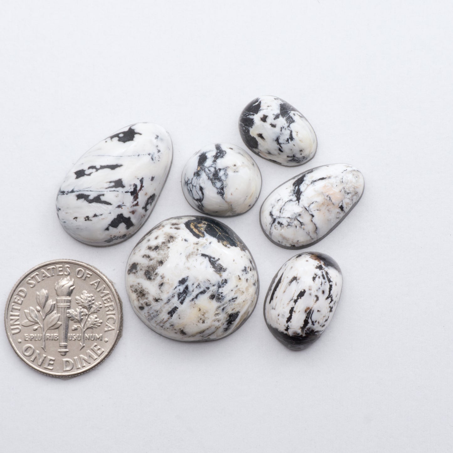 These Natural White Buffalo Stone Cabochons are semi-precious gemstones cut into shapes ideal for jewelry-making and crafting and are backed for added strength. 