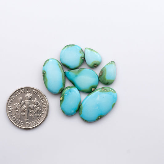 Discover the unique beauty of Sonoran Mountain Turquoise. This rare gemstone showcases a stunning blend of blue and green hues.