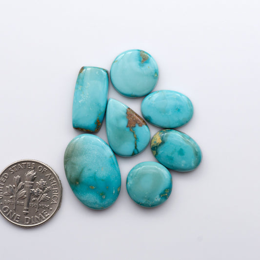 Gorgeous Sonoran South Hill Turquoise cabochons are perfect for jewelry making or collecting. Known for its stunning blue-green color and rarity, this gem will add a touch of elegance to any piece.