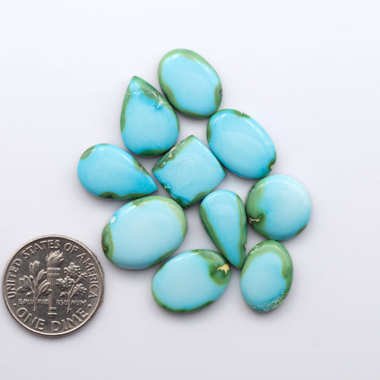 Discover the unique beauty of Sonoran Mountain Turquoise. This rare gemstone showcases a stunning blend of blue and green hues.