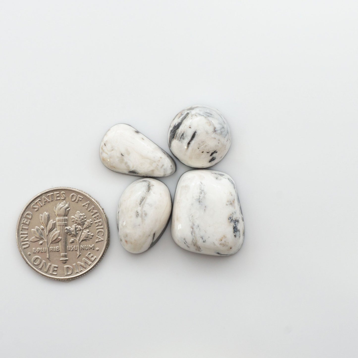 Our Natural White Buffalo Stone Cabochons are semi-precious gemstones cut into shapes ideal for jewelry-making, crafting and are backed for added strength. 