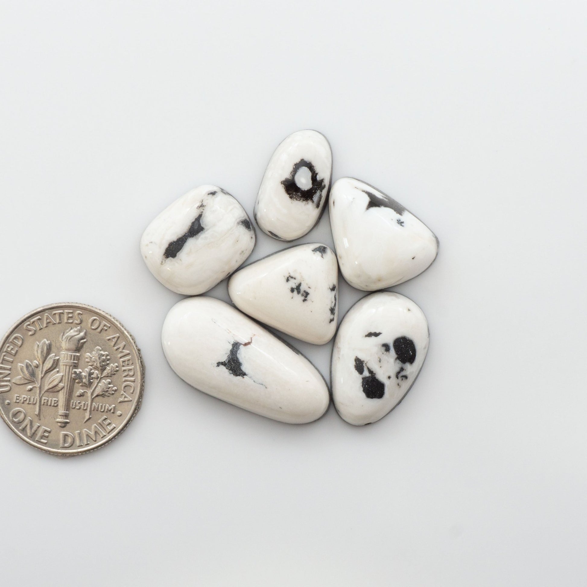 Our Natural White Buffalo Stone Cabochons are semi-precious gemstones cut into shapes ideal for jewelry-making, crafting and are backed for added strength. 