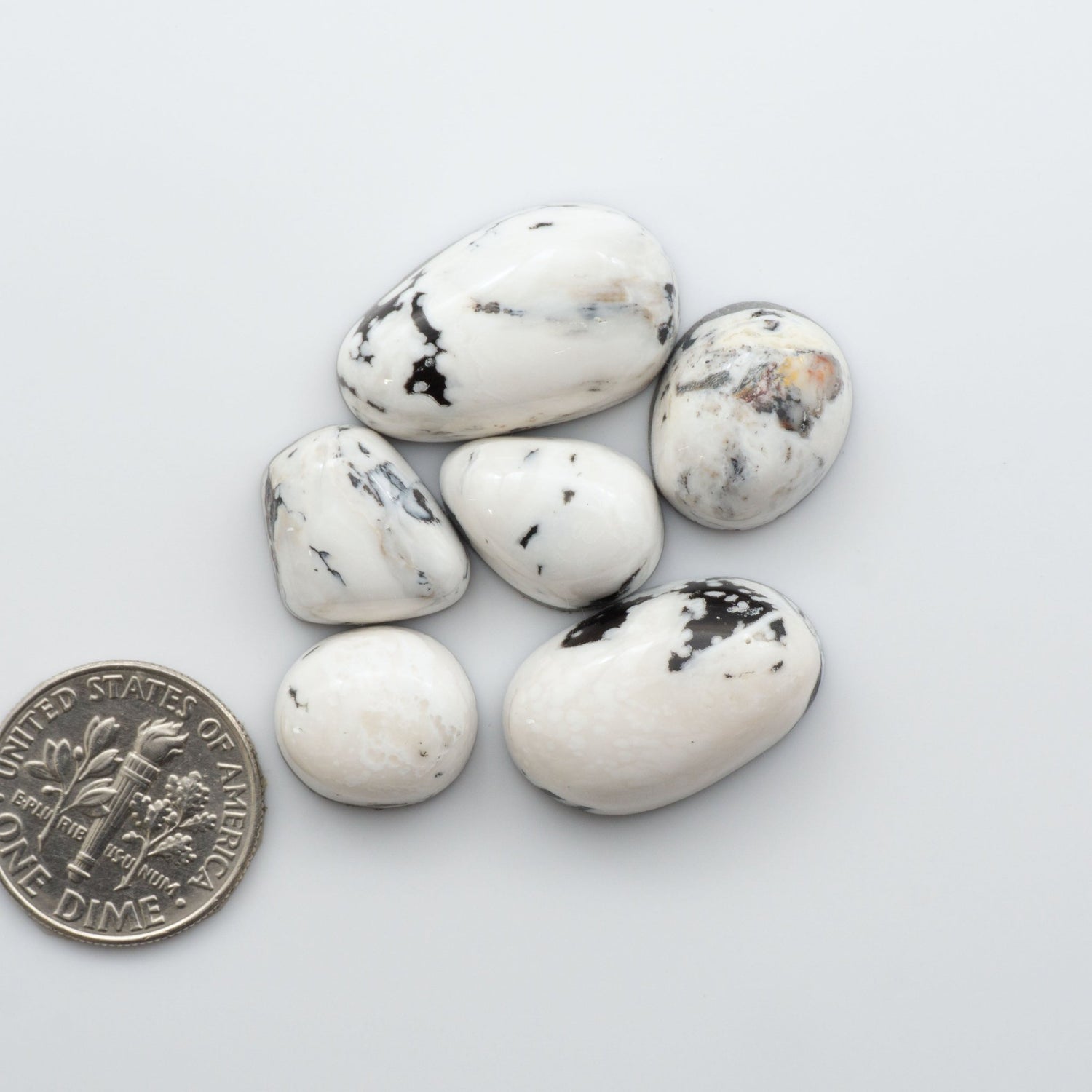 Our Natural White Buffalo Stone Cabochons are semi-precious gemstones cut into shapes ideal for jewelry-making