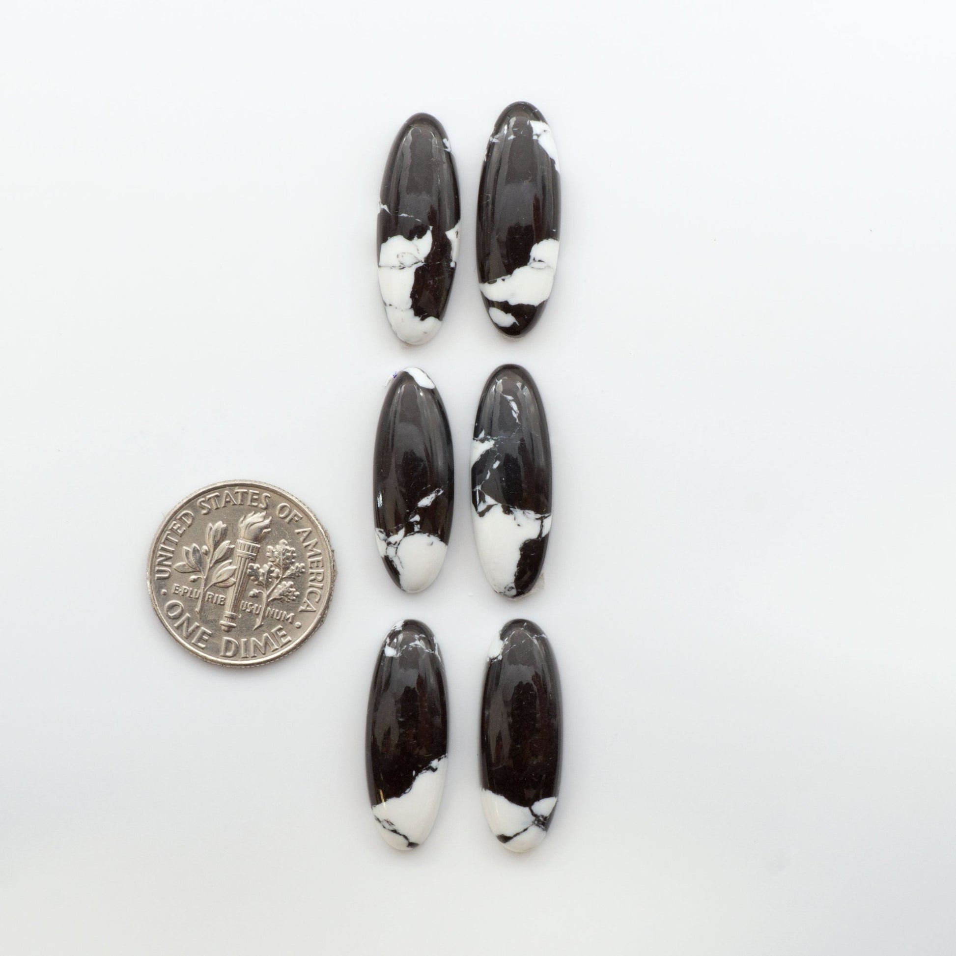 Crafted by skillful hands, these calibrated White Buffalo Cabochons are meticulously cut and polished from composite material, resulting in a breathtaking and long-lasting gemstone. 