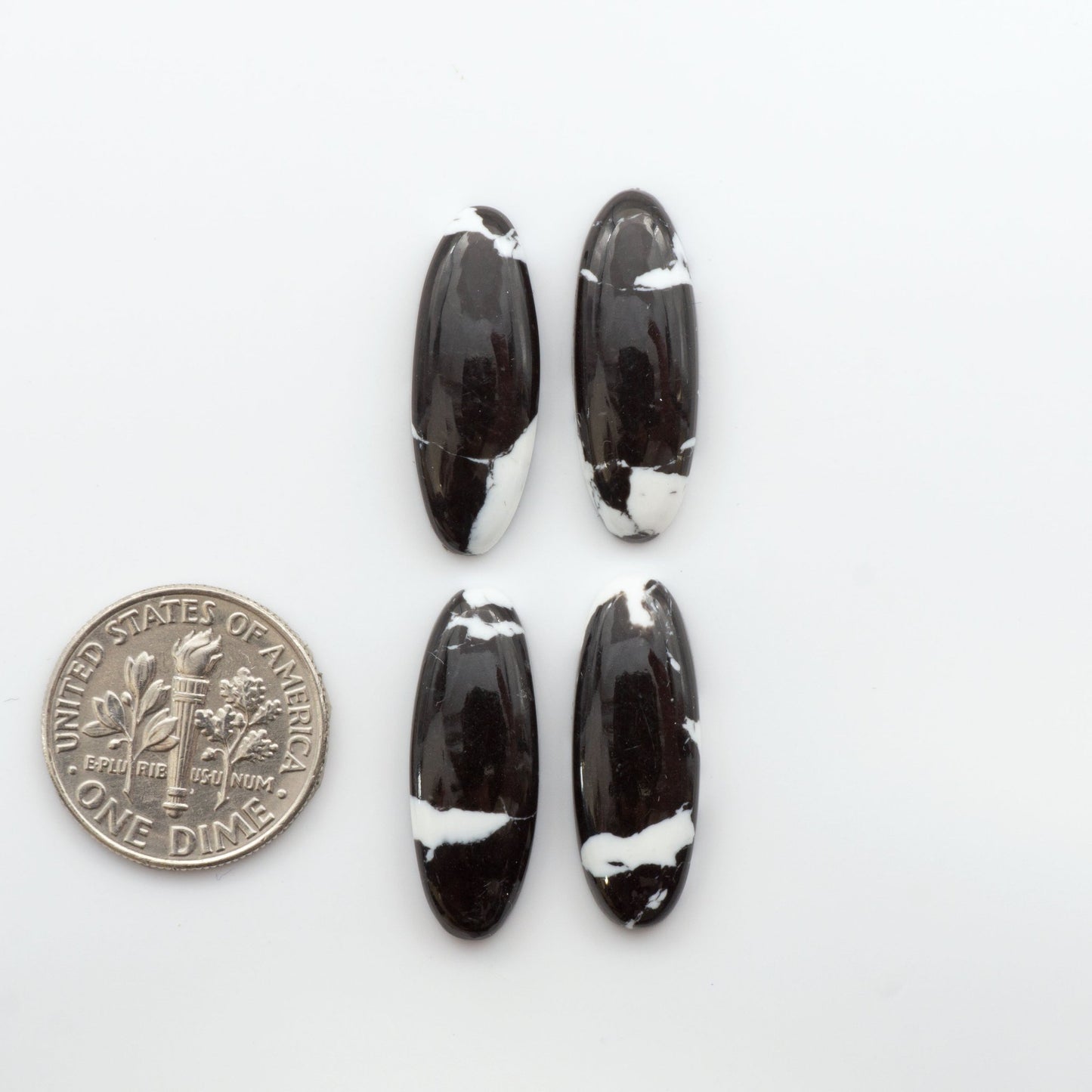 Crafted by skillful hands, these calibrated White Buffalo Cabochons are meticulously cut and polished from composite material, resulting in a breathtaking and long-lasting gemstone. 