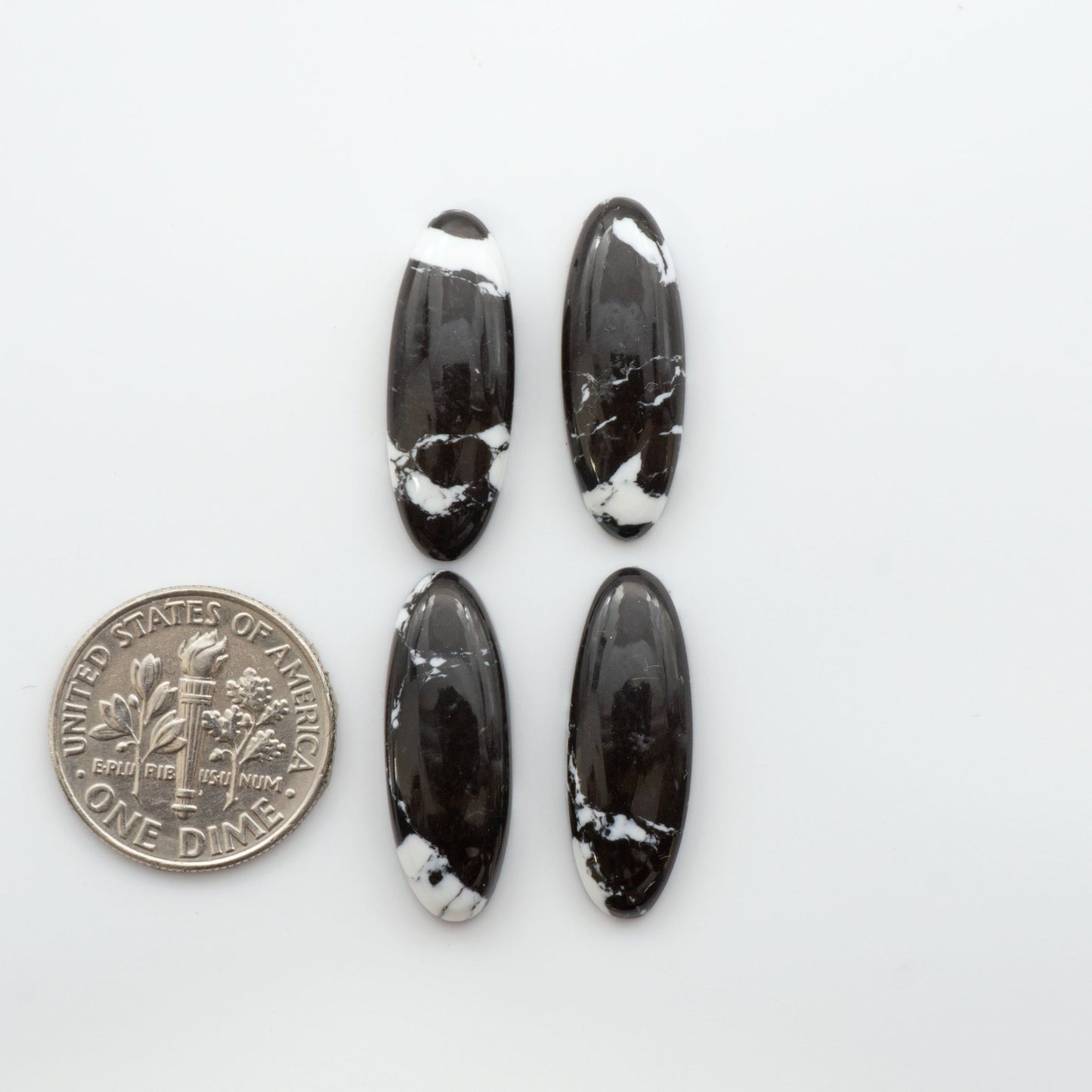 Crafted by skillful hands, these calibrated White Buffalo Cabochons are meticulously cut and polished from composite material, resulting in a breathtaking and long-lasting gemstone. 