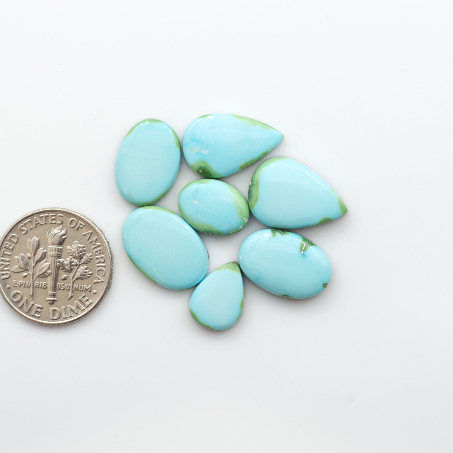 Discover the unique beauty of Sonoran Mountain Turquoise. This rare gemstone showcases a stunning blend of blue and green hues.