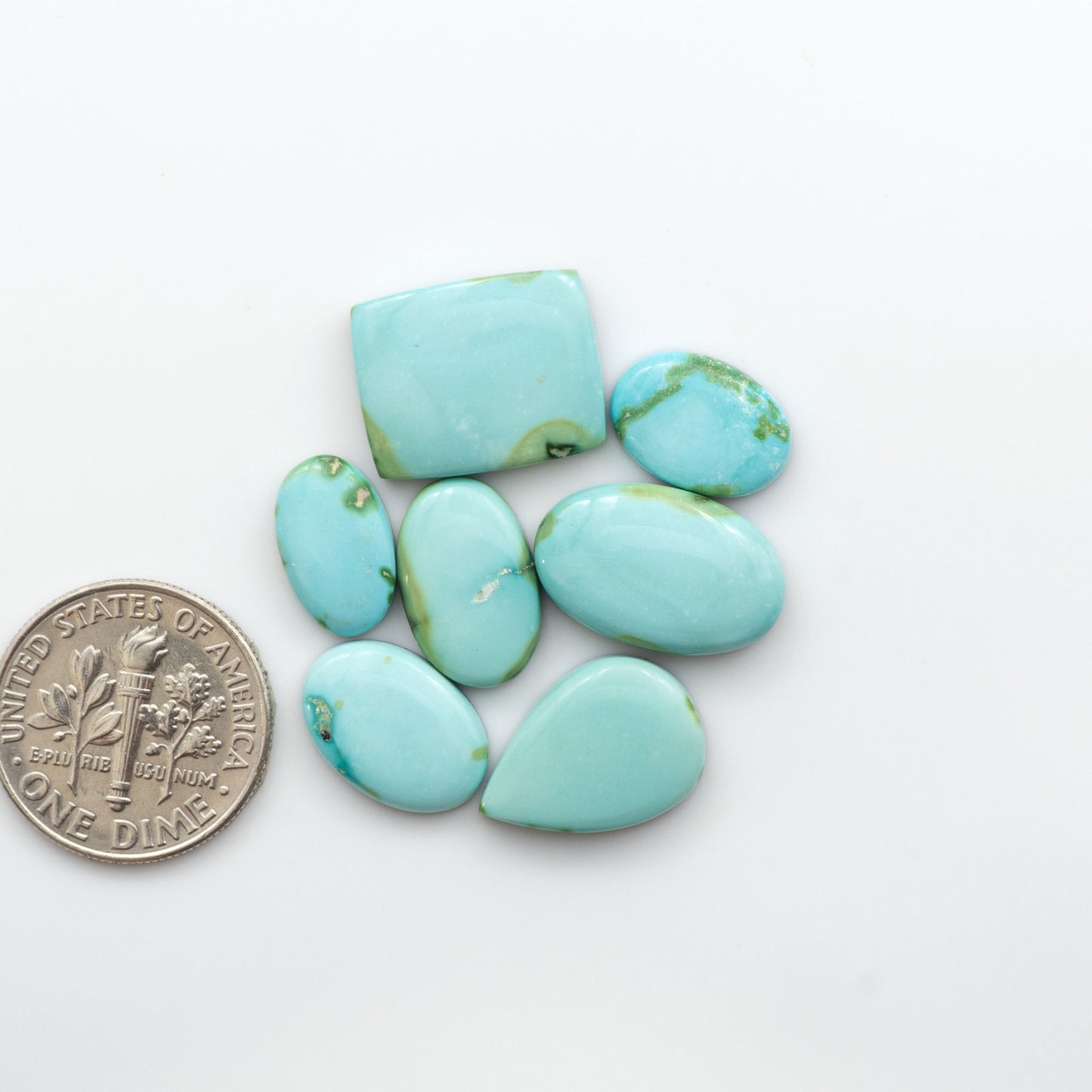 Discover the unique beauty of Sonoran Mountain Turquoise. This rare gemstone showcases a stunning blend of blue and green hues.