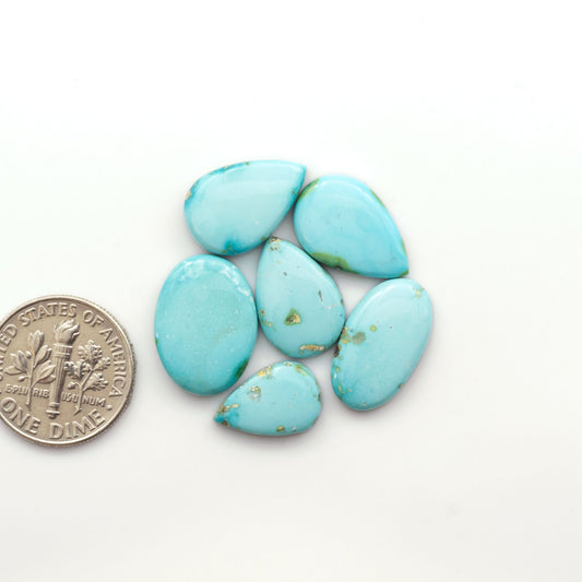 Discover the unique beauty of Sonoran Mountain Turquoise. This rare gemstone showcases a stunning blend of blue and green hues.