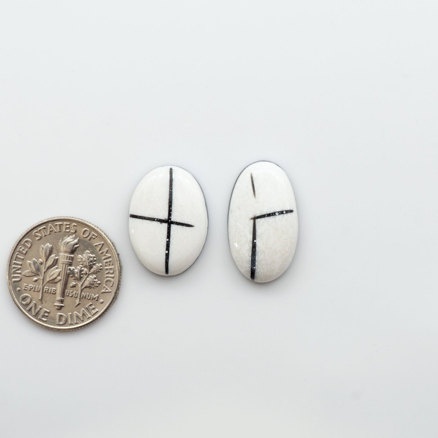 Crafted by skillful hands, these calibrated White Buffalo Cabochons are meticulously cut and polished from composite material, resulting in a breathtaking and long-lasting gemstone.