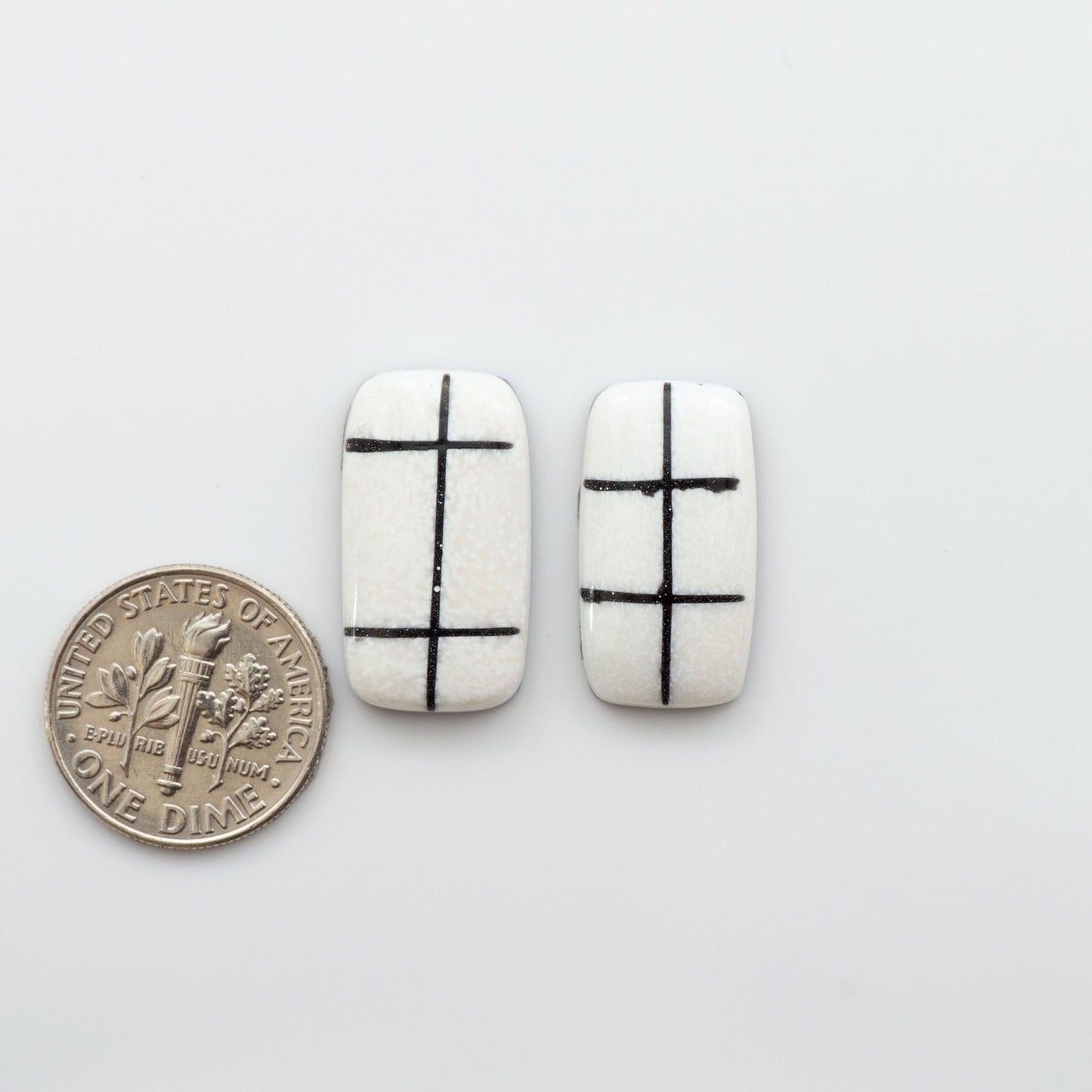 Crafted by skillful hands, these calibrated White Buffalo Cabochons are meticulously cut and polished from composite material, resulting in a breathtaking and long-lasting gemstone.