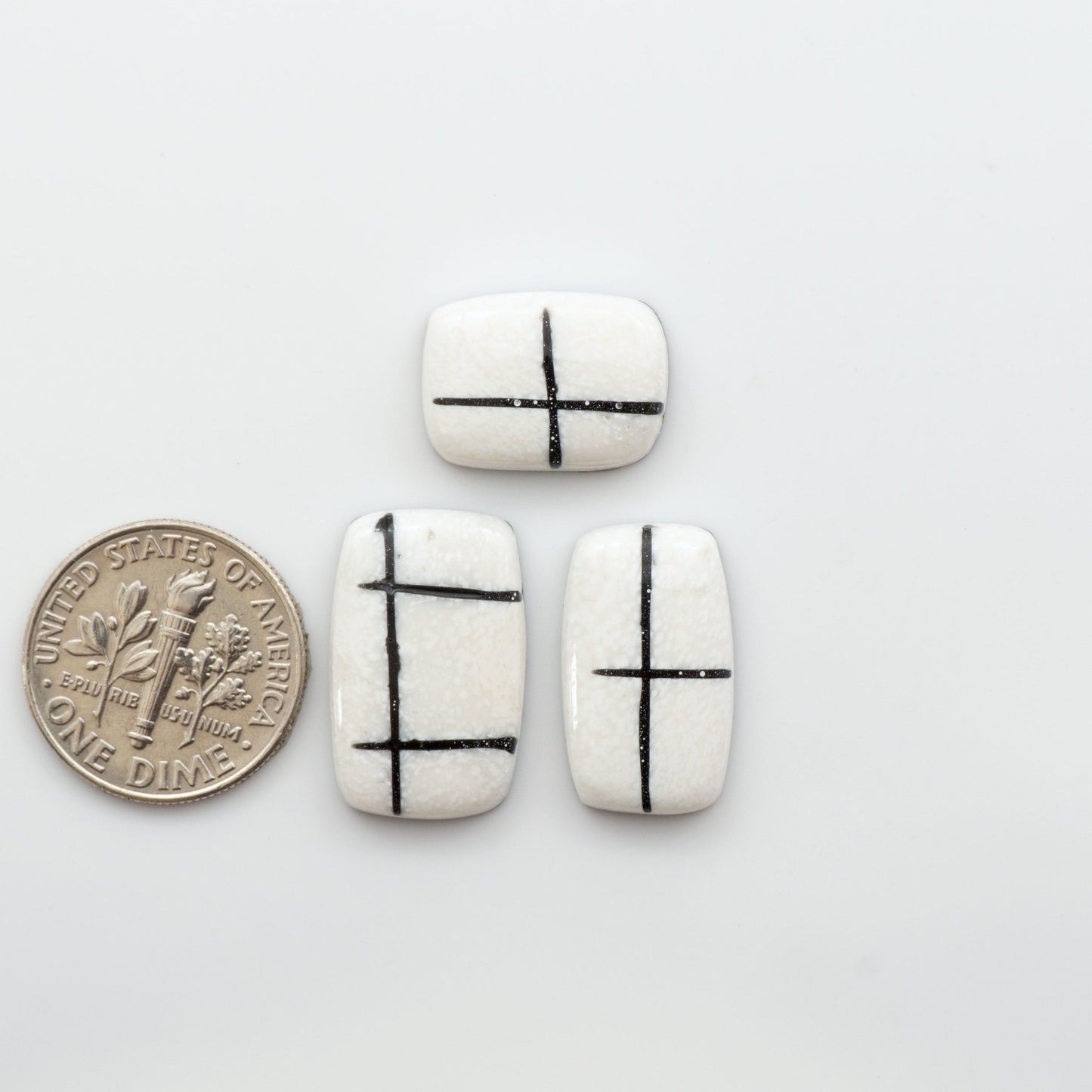 Crafted by skillful hands, these calibrated White Buffalo Cabochons are meticulously cut and polished from composite material, resulting in a breathtaking and long-lasting gemstone.