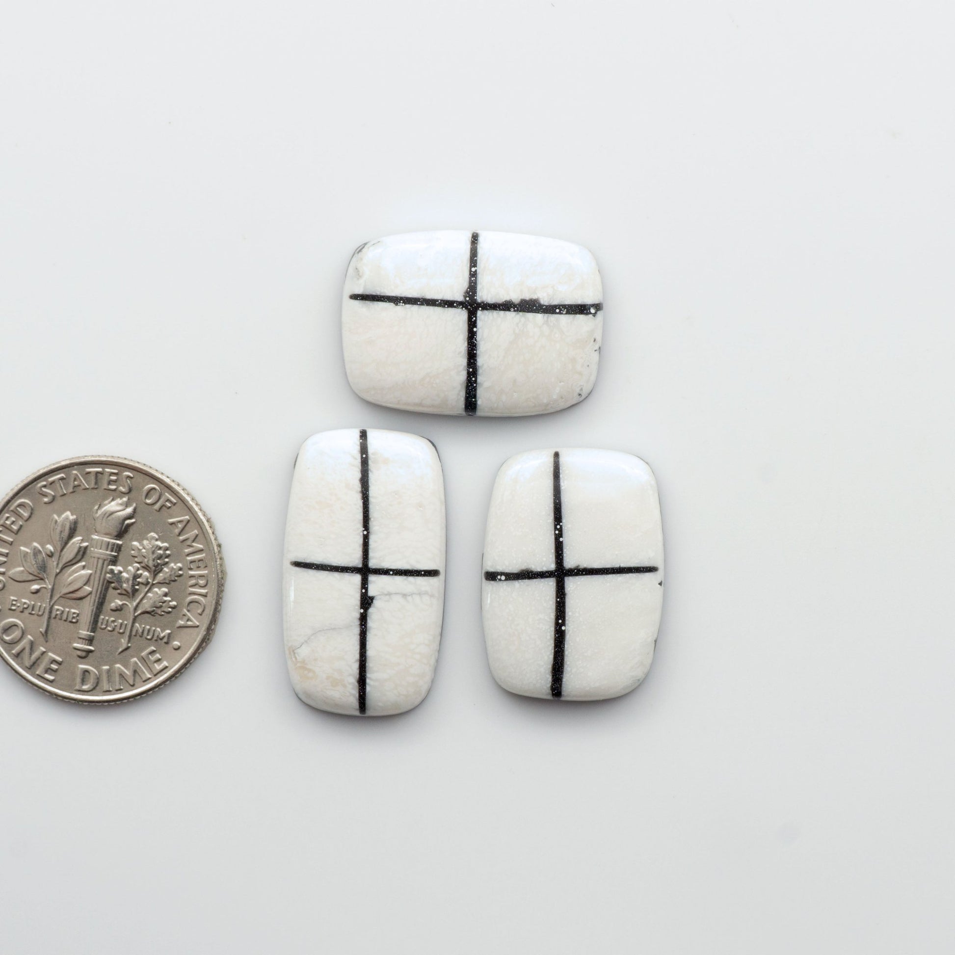 Crafted by skillful hands, these calibrated White Buffalo Cabochons are meticulously cut and polished from composite material, resulting in a breathtaking and long-lasting gemstone.