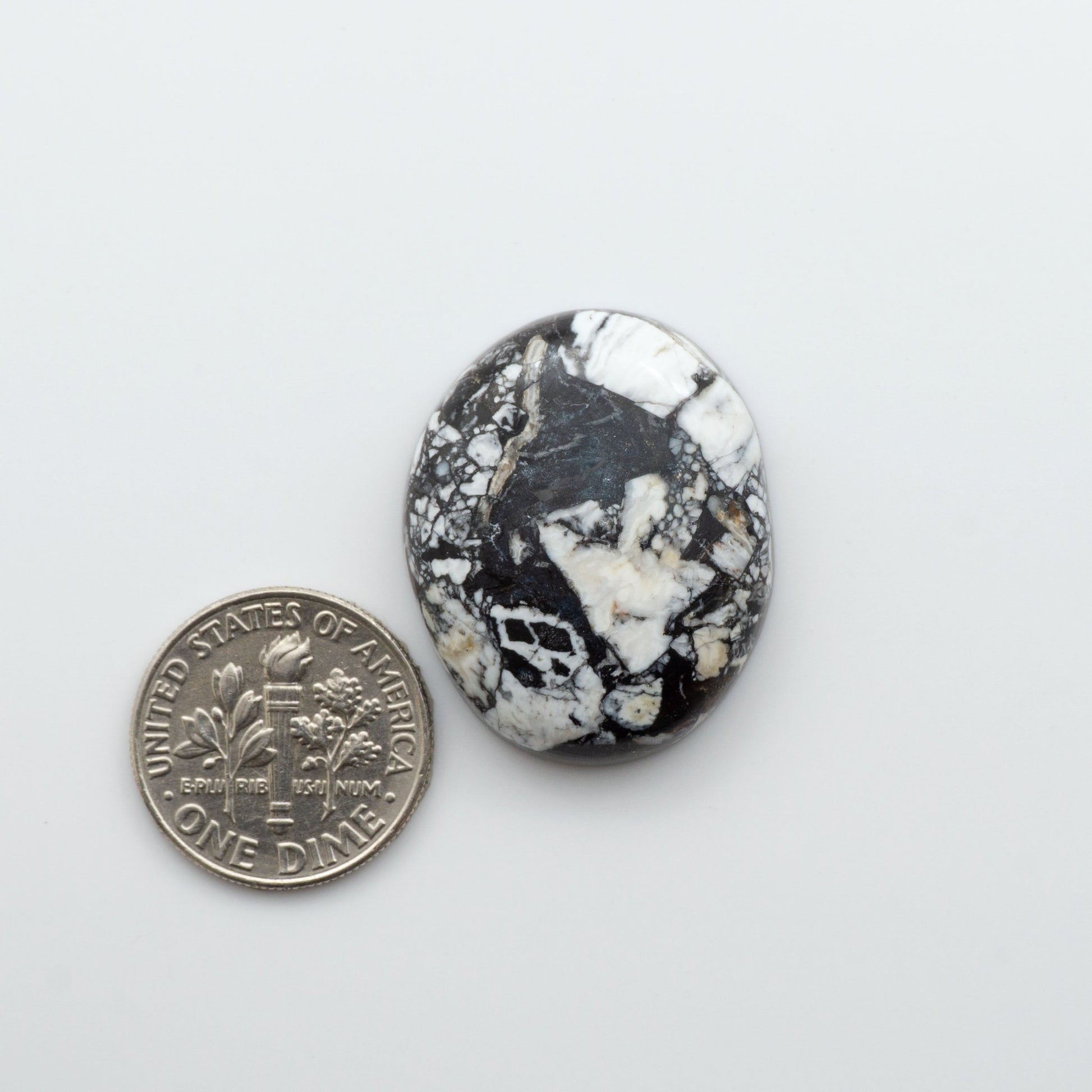 White Buffalo Stone Cabochons are semi-precious gemstones cut into shapes ideal for jewelry-making and crafting.