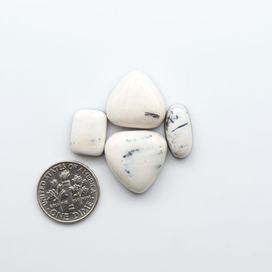 Natural White Buffalo Stone Cabochons are semi-precious gemstones backed for added strength and cut into shapes ideal for jewelry-making and crafting.