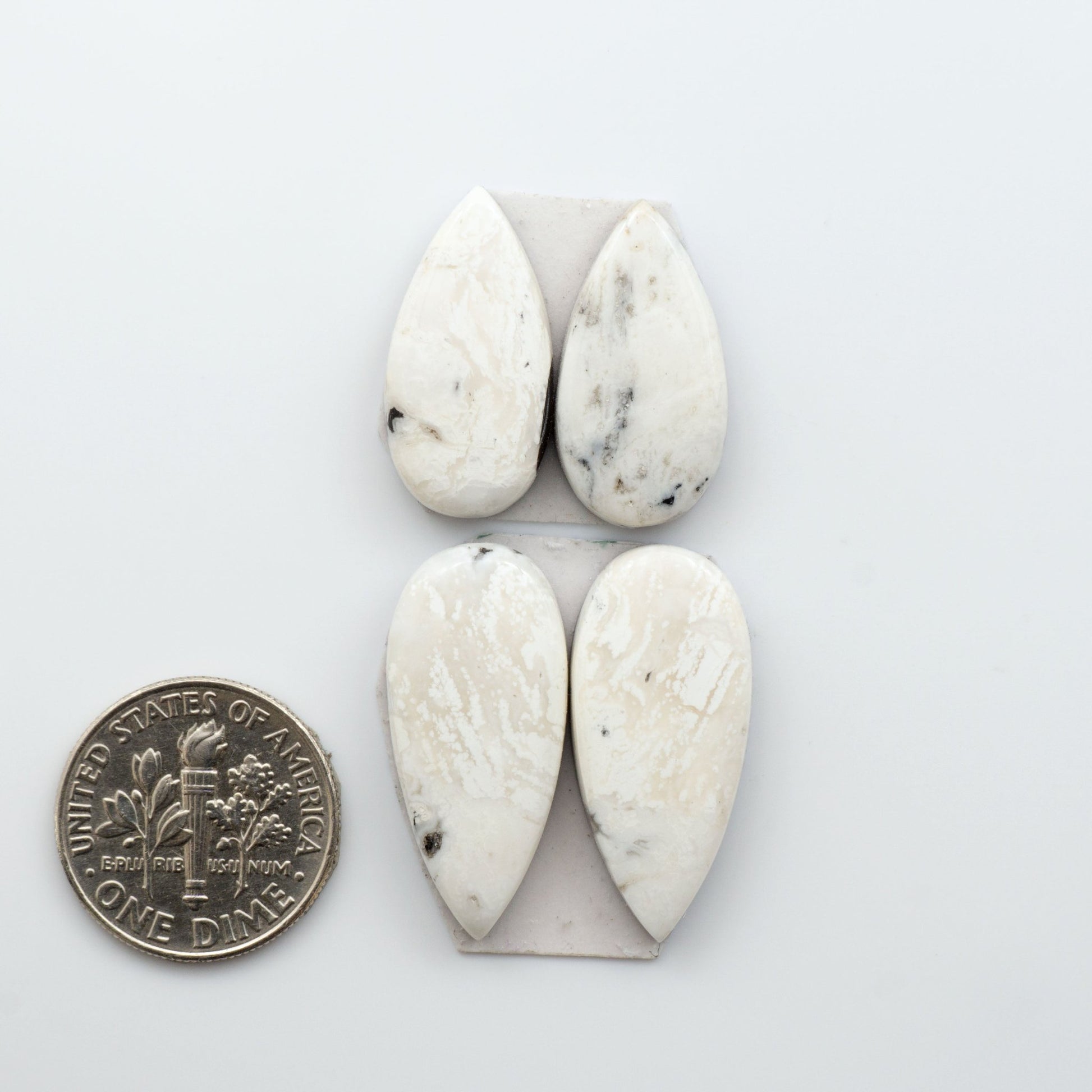 White Buffalo Stone Cabochons are semi-precious gemstones backed for added strength and cut into shapes ideal for jewelry-making and crafting. 