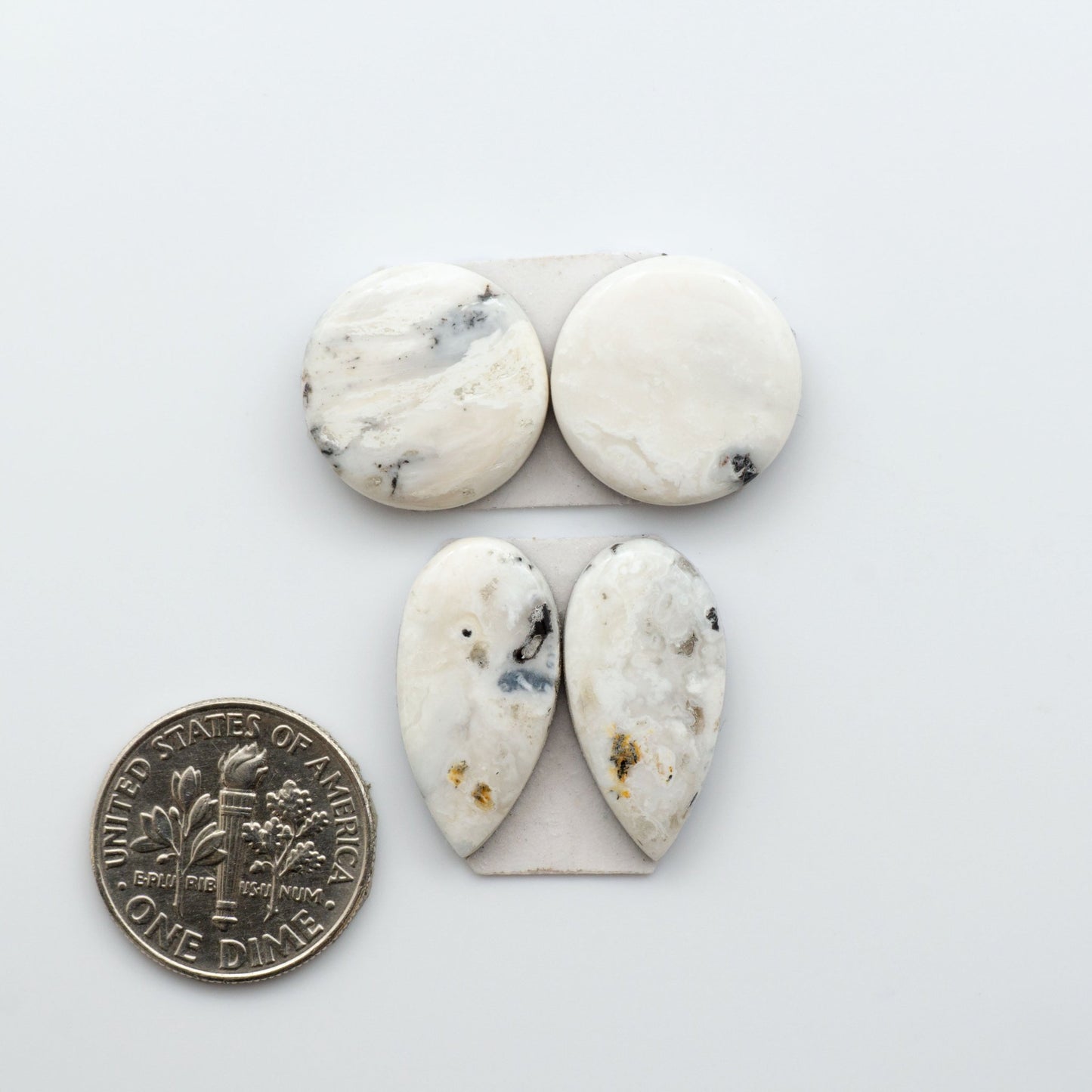 White Buffalo Stone Cabochons are semi-precious gemstones backed for added strength and cut into shapes ideal for jewelry-making and crafting. 