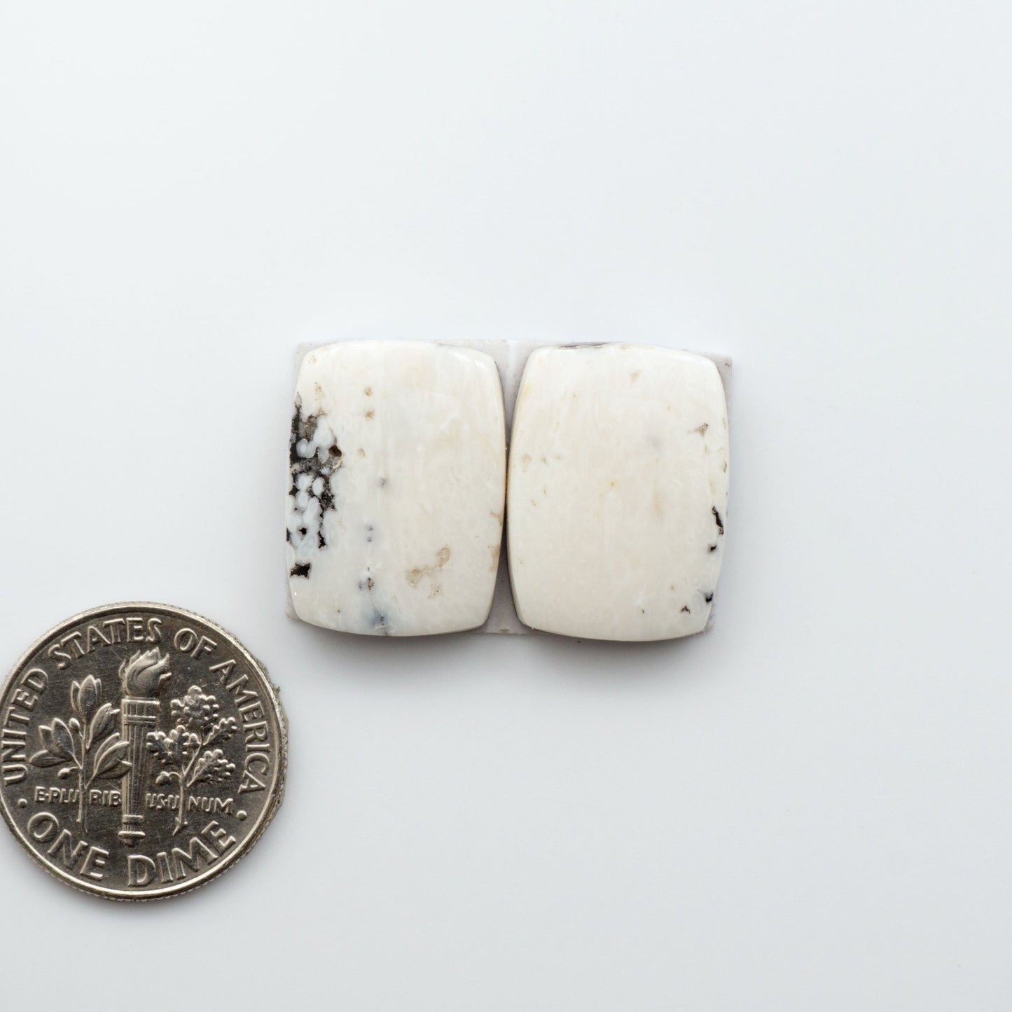 White Buffalo Stone Cabochons are semi-precious gemstones backed for added strength and cut into shapes ideal for jewelry-making and crafting. 