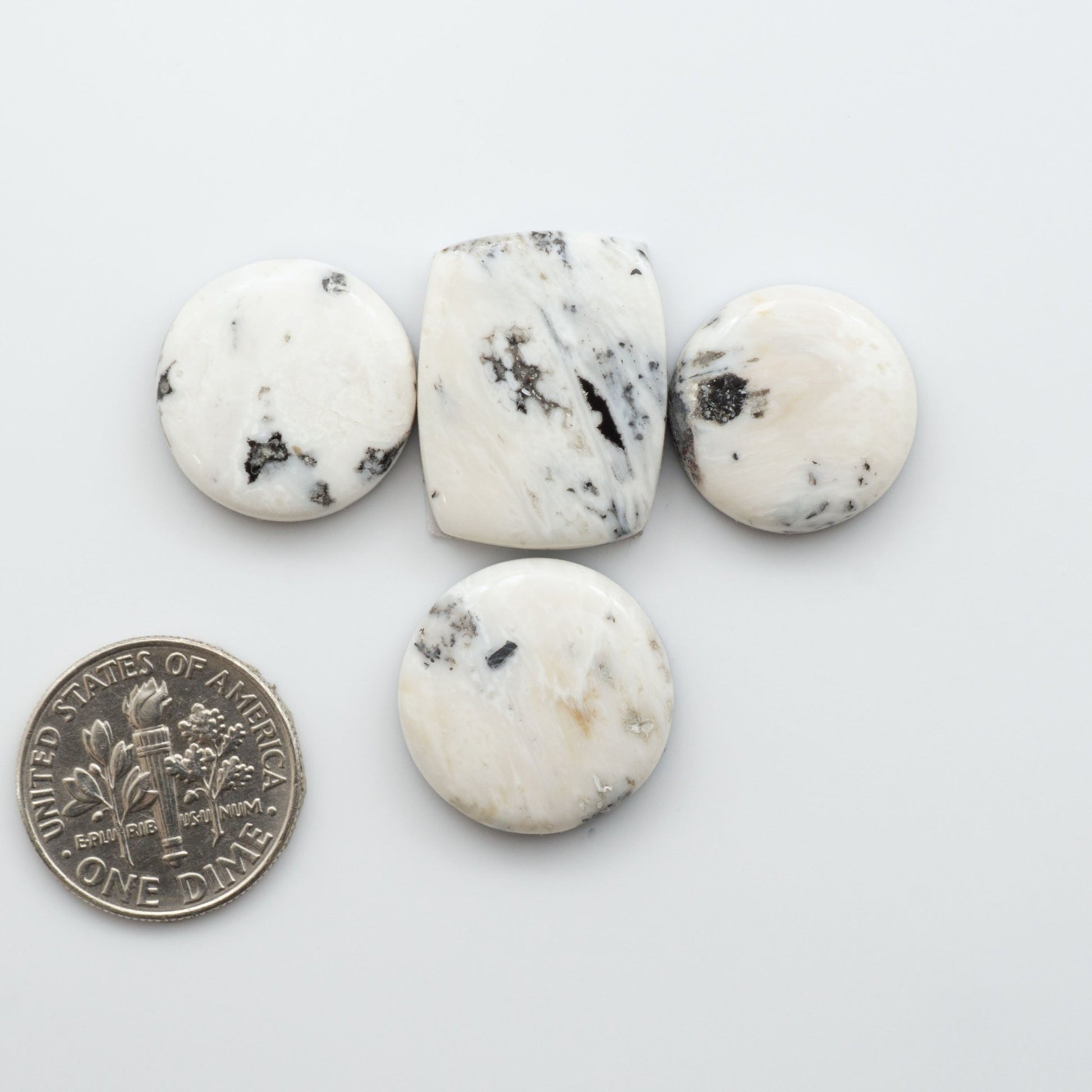 White Buffalo Stone Cabochons are semi-precious gemstones backed for added strength and cut into shapes ideal for jewelry-making and crafting. 