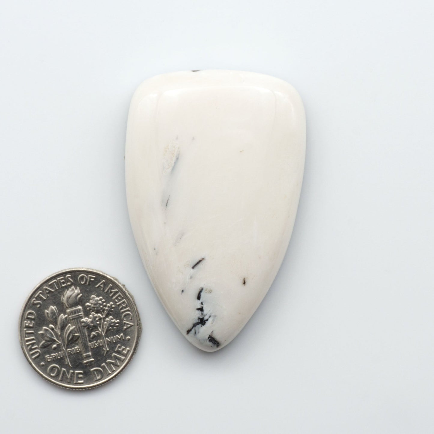 These Natural White Buffalo Stone Cabochons are semi-precious gemstones cut into shapes ideal for jewelry-making and crafting 