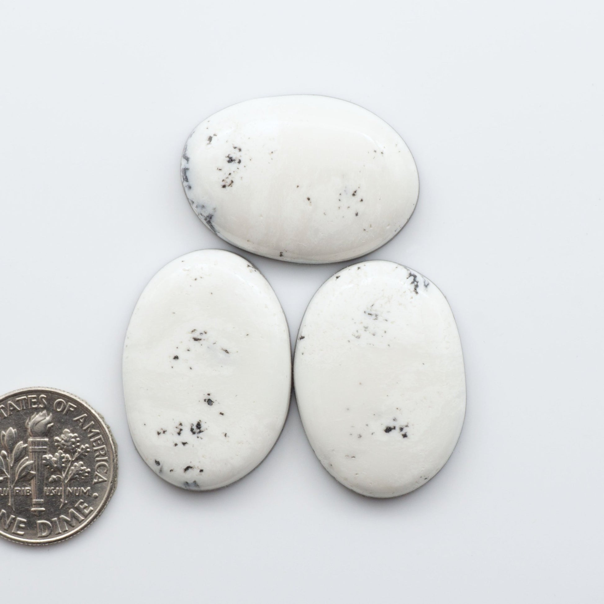 These Natural White Buffalo Stone Cabochons are semi-precious gemstones cut into shapes ideal for jewelry-making 