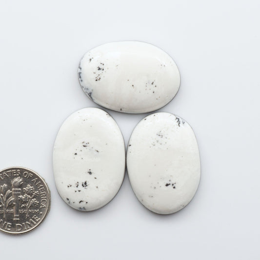 These Natural White Buffalo Stone Cabochons are semi-precious gemstones cut into shapes ideal for jewelry-making 