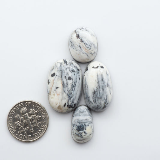 These Natural White Buffalo Stone Cabochons are semi-precious gemstones cut into shapes ideal for jewelry-making 