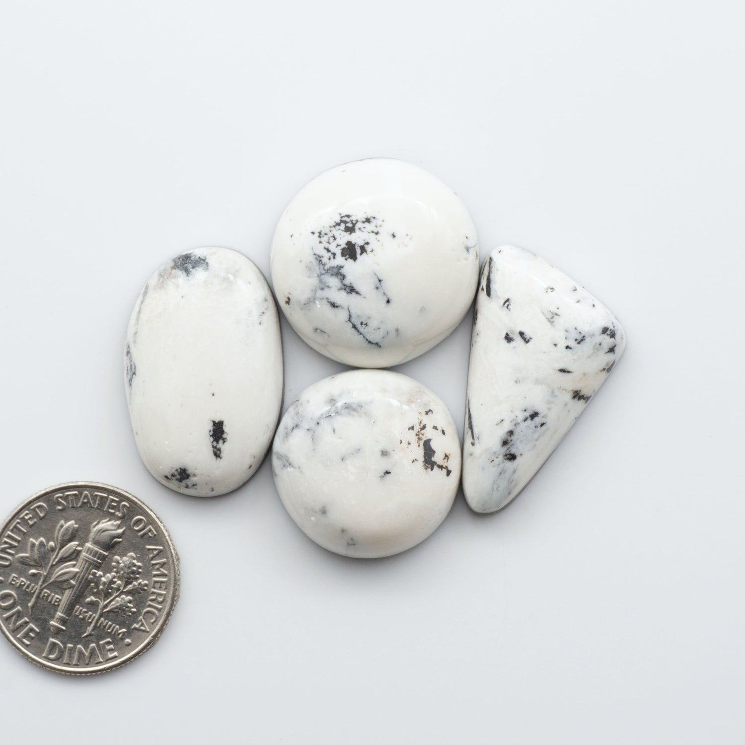 These Natural White Buffalo Stone Cabochons are semi-precious gemstones cut into shapes ideal for jewelry-making