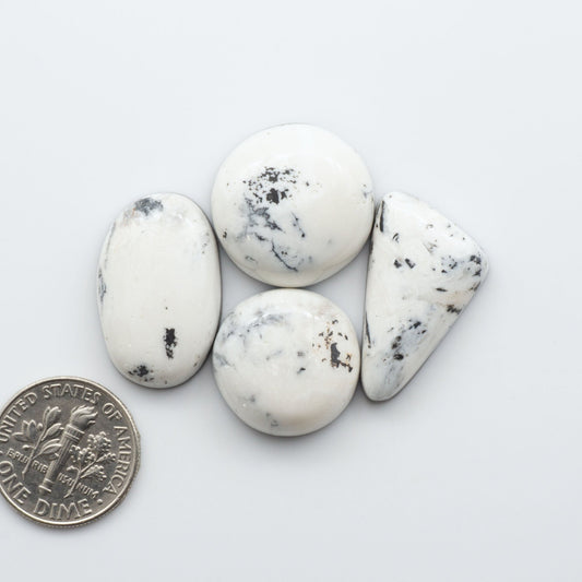 These Natural White Buffalo Stone Cabochons are semi-precious gemstones cut into shapes ideal for jewelry-making