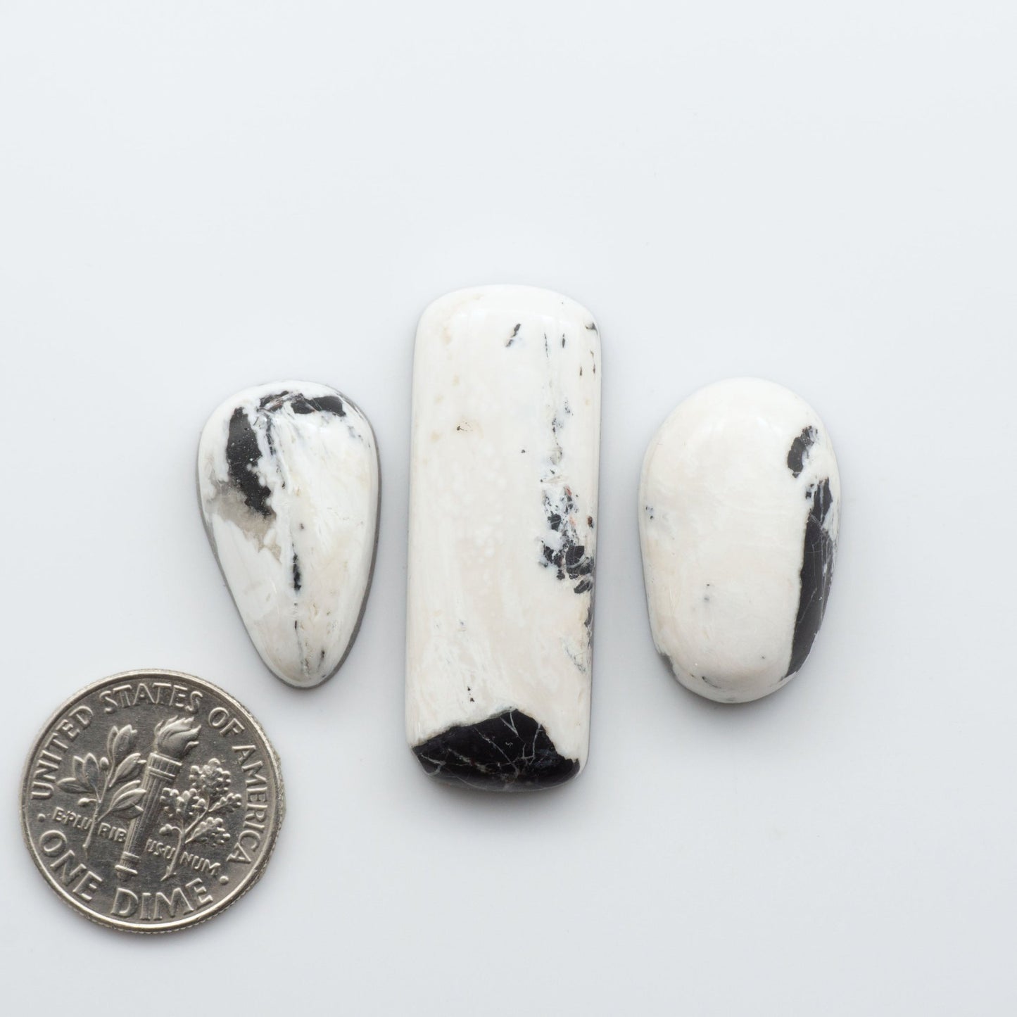 These Natural White Buffalo Stone Cabochons are semi-precious gemstones cut into shapes ideal for jewelry-making