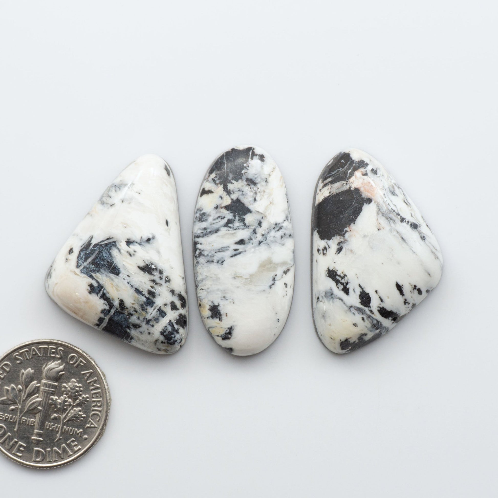 These Natural White Buffalo Stone Cabochons are semi-precious gemstones cut into shapes ideal for jewelry-making