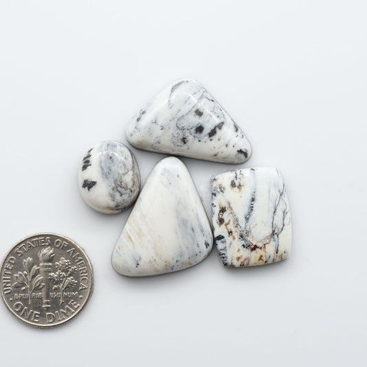 These Natural White Buffalo Stone Cabochons are semi-precious gemstones cut into shapes ideal for jewelry-making