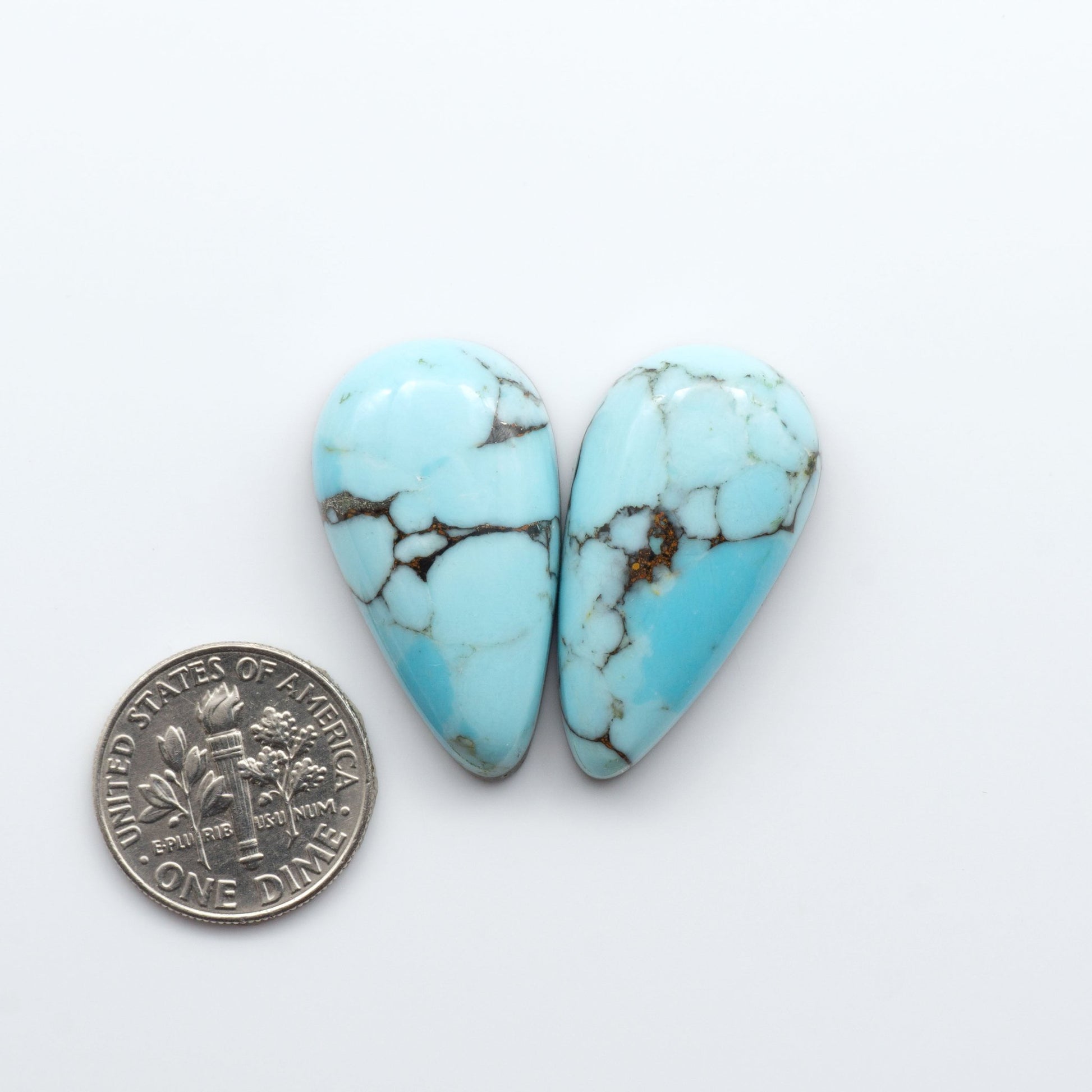 Enhance your jewelry designs with Pressed Turquoise Nugget Cabochons. Crafted from composite materials they add a captivating touch to your creations.