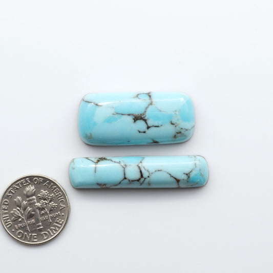 Enhance your jewelry designs with Pressed Turquoise Nugget Cabochons. Crafted from composite materials they add a captivating touch to your creations.