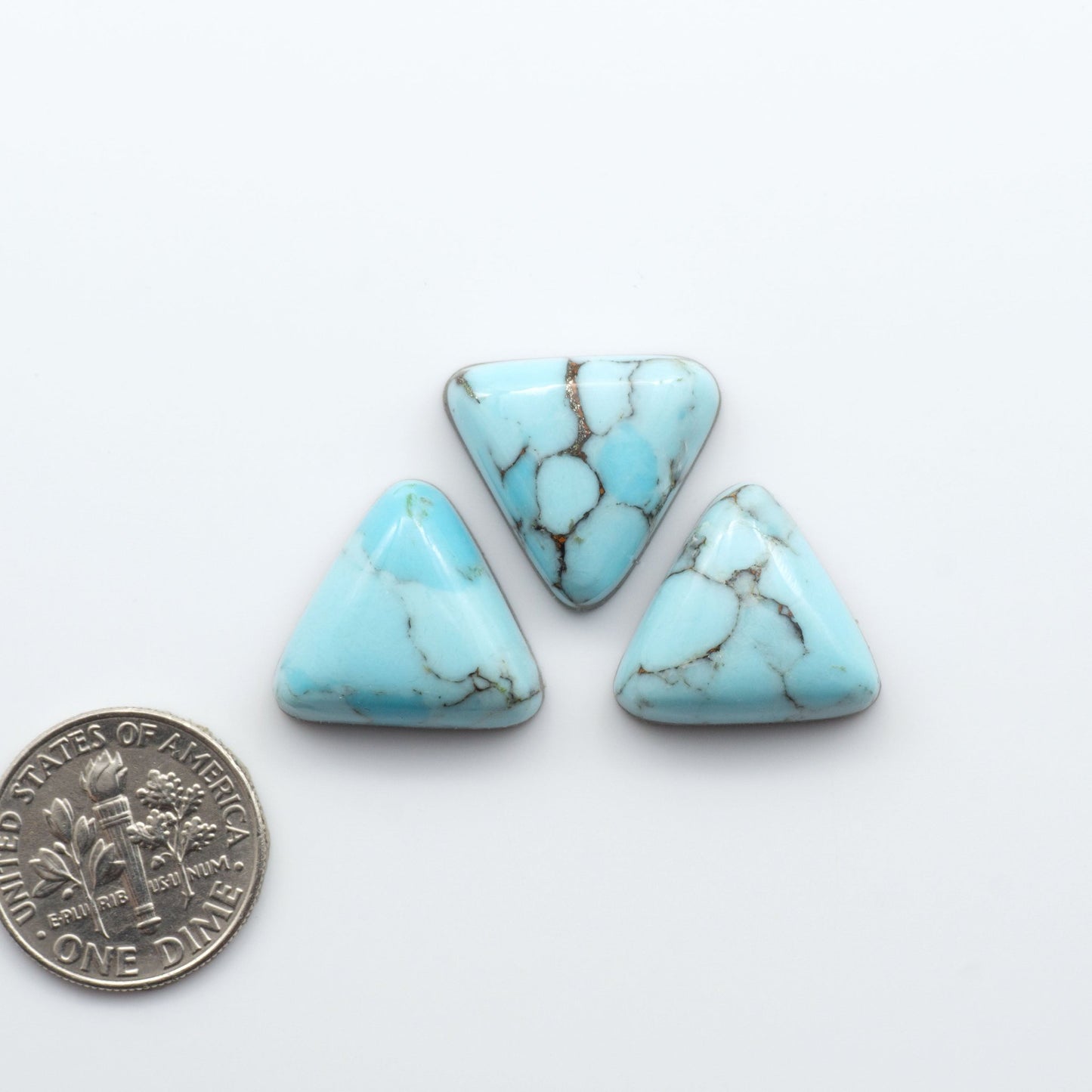 Enhance your jewelry designs with Pressed Turquoise Nugget Cabochons. Crafted from composite materials they add a captivating touch to your creations.