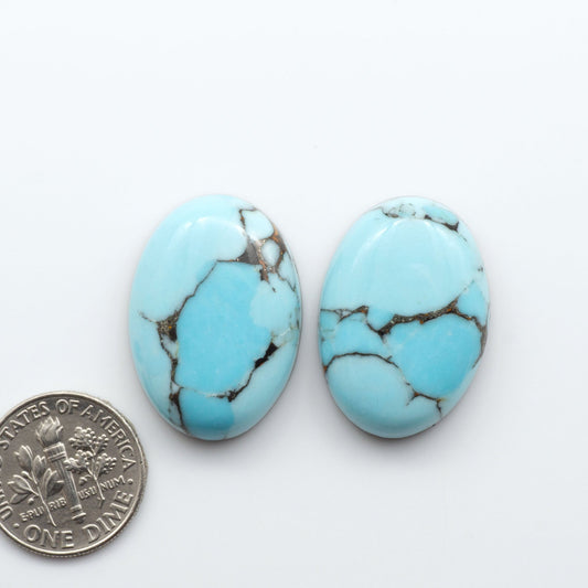 Enhance your jewelry designs with Pressed Turquoise Nugget Cabochons. Crafted from composite materials they add a captivating touch to your creations.